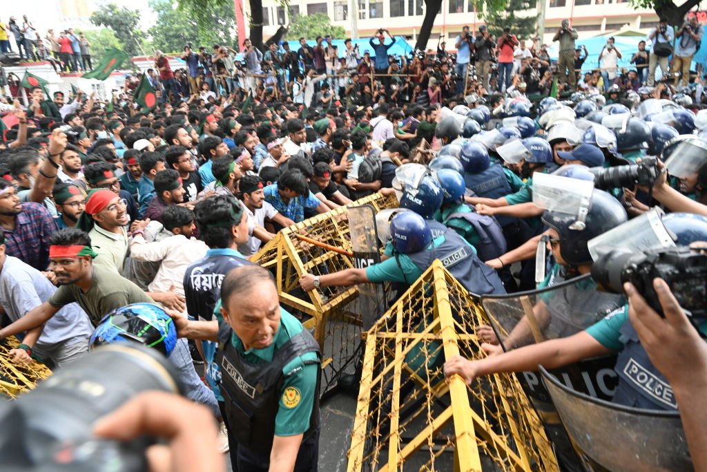 Students are trying to get past police barricades during a march towards the President's house 'Bangabhaban' to submit their memorandum demanding a reform in the quota system for government jobs, in Dhaka, Bangladesh, on July 14, 2024. (Photo by Mamunur Rashid/NurPhoto via Getty Images)